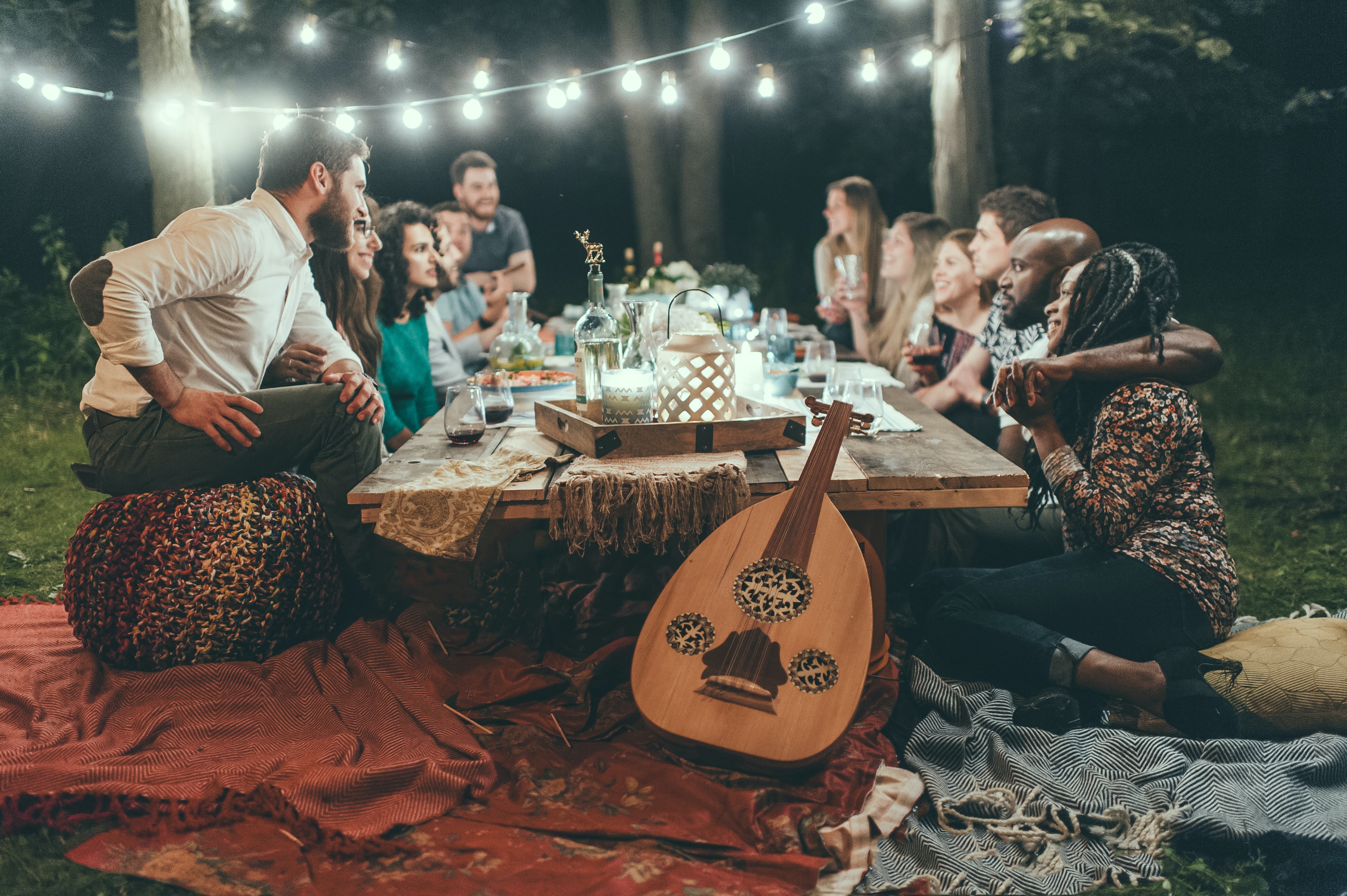 group of people enjoying an outdoor dinner party